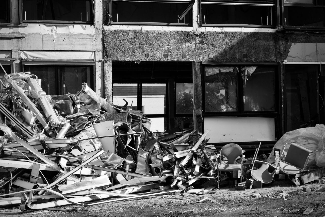 Black and white photo of urban building debris. Ideal for themes of demolition or construction.