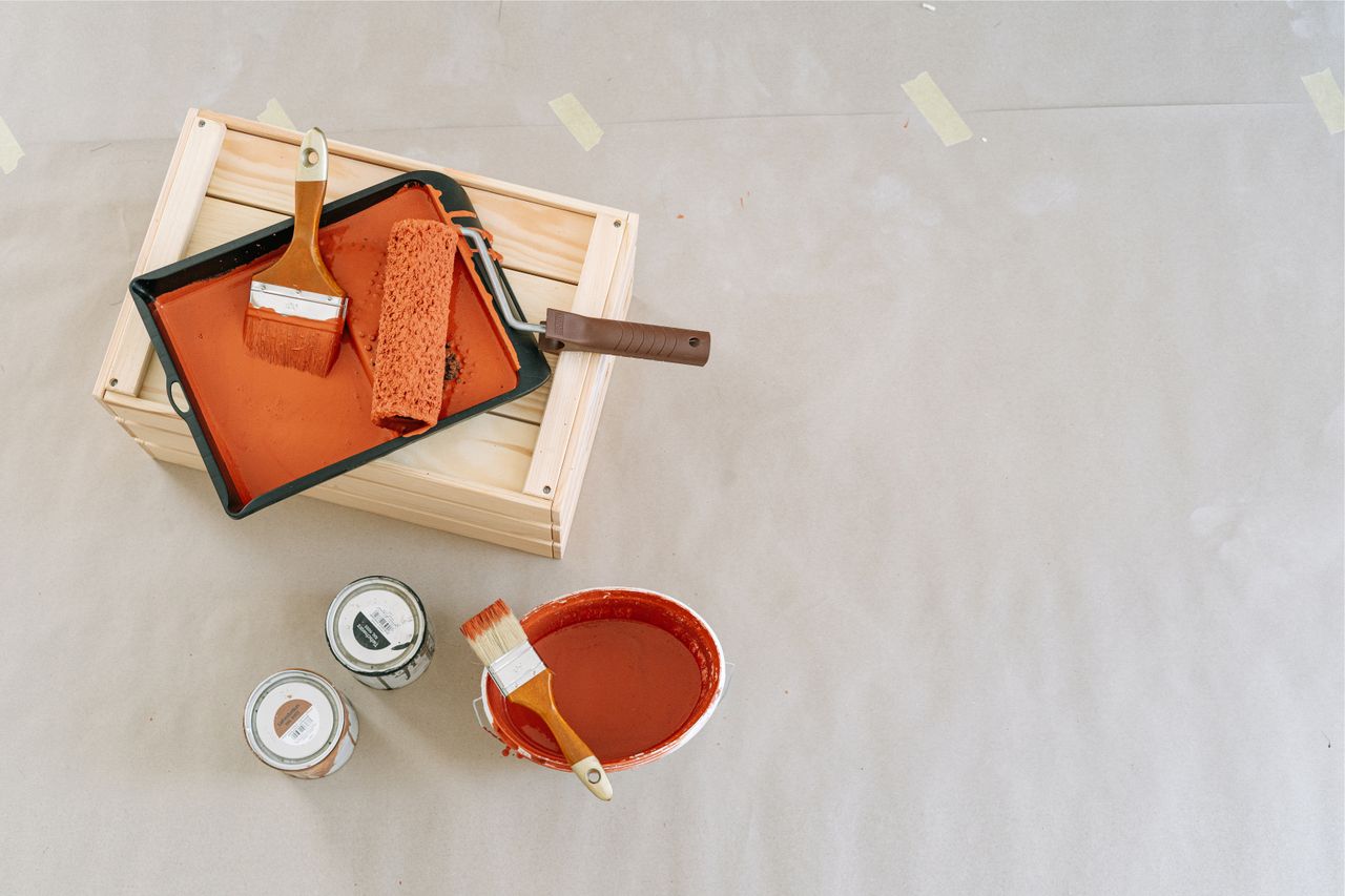 about-us-02 Explore this overhead view of essential painting tools and supplies perfect for home renovation projects.